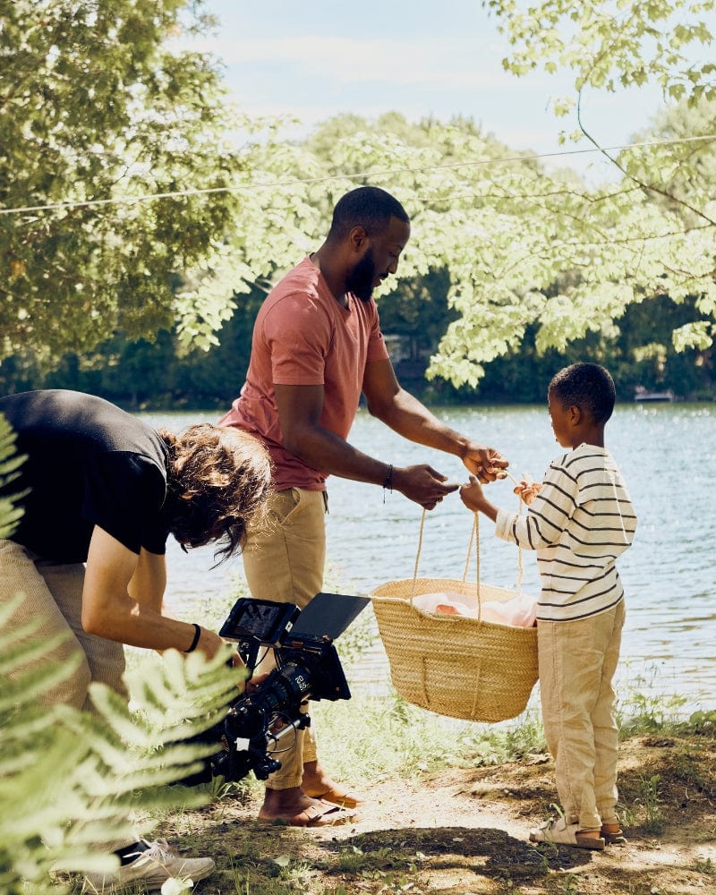 A dad and his son by the lake, being film