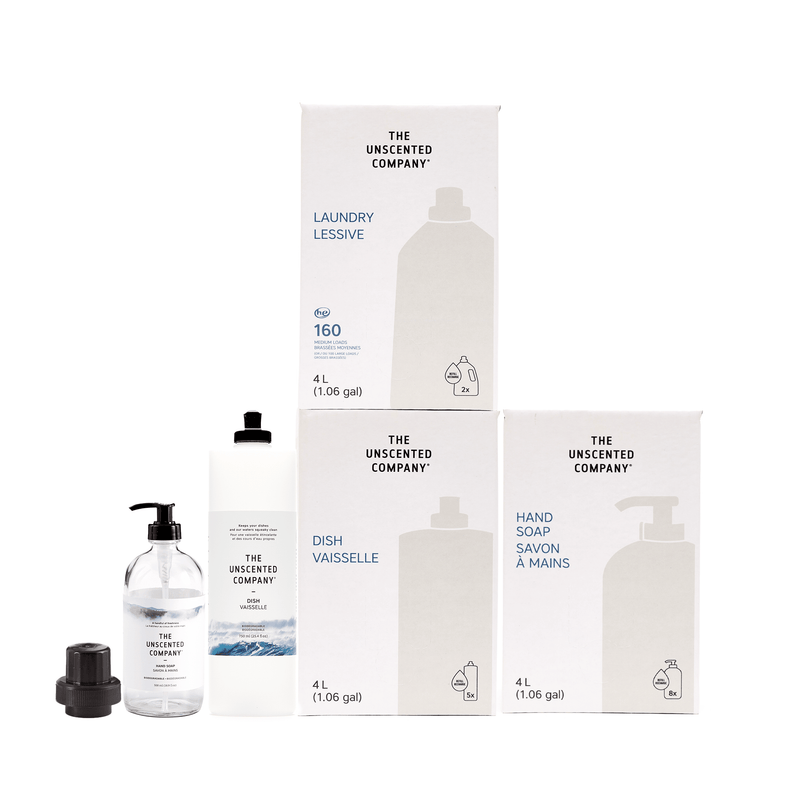 The Unscented Company At-Home Refill Station Kit including 4L laundry detergent, dish soap, hand soap, and all-purpose cleaner with reusable glass and plastic dispenser bottles.