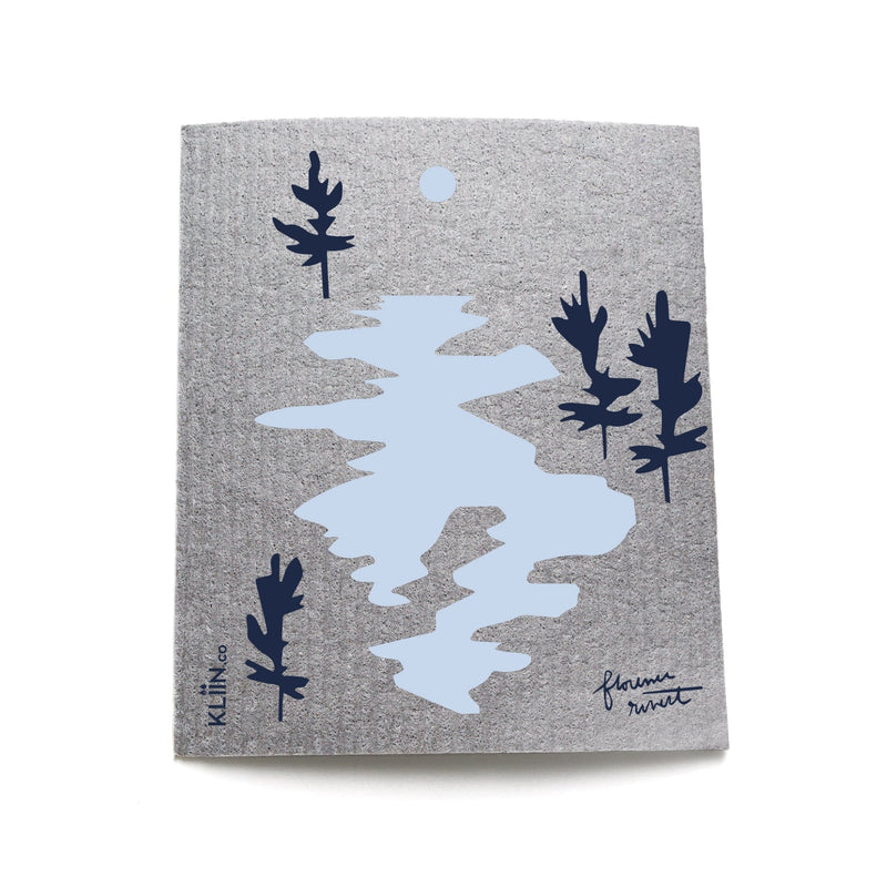 Grey reusable cloth with navy blue trees and light blue lake design by Florence Rivest for KLIIN.