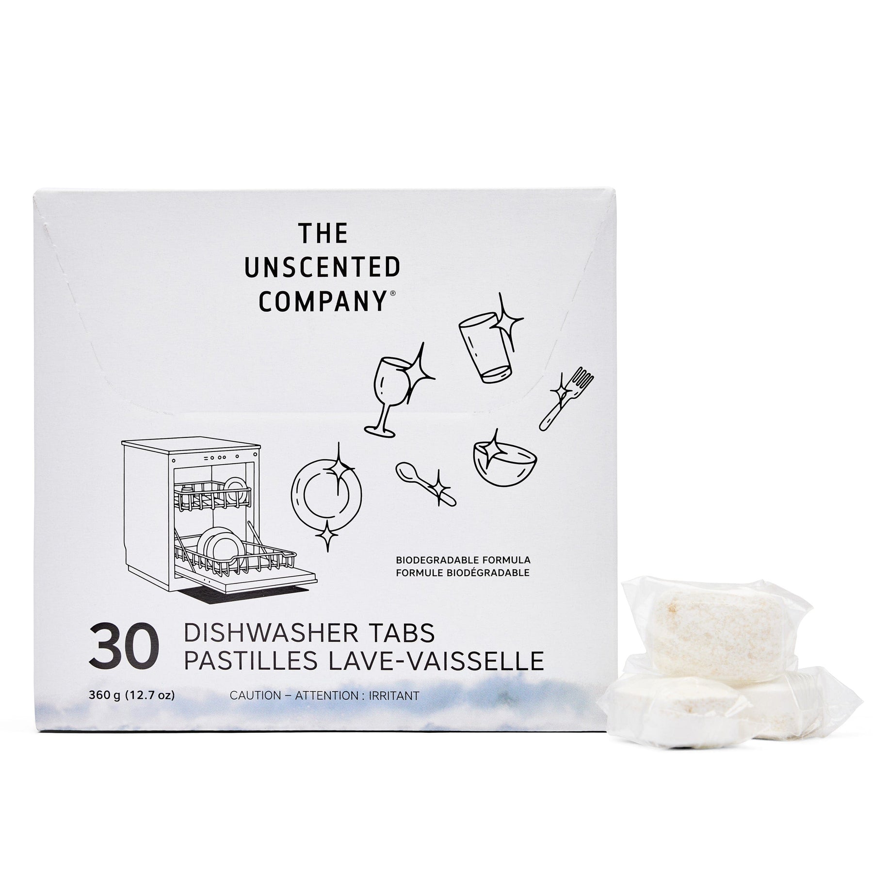 Front view of The Unscented Company dishwasher tabs box (30 count). The packaging is white with black illustrations of sparkling dishes and utensils. Includes branding, bilingual product name (Dishwasher Tabs / Pastilles Lave-Vaisselle), and two visible individually wrapped tabs placed beside the box. States “Biodegradable Formula” and highlights weight: 360 g (12.7 oz).