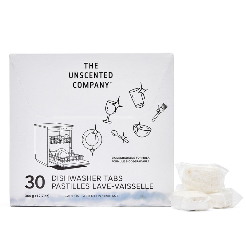 Front view of The Unscented Company dishwasher tabs box (30 count). The packaging is white with black illustrations of sparkling dishes and utensils. Includes branding, bilingual product name (Dishwasher Tabs / Pastilles Lave-Vaisselle), and two visible individually wrapped tabs placed beside the box. States “Biodegradable Formula” and highlights weight: 360 g (12.7 oz).
