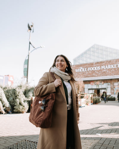 Anie Rouleau, founder of The Unscented Company, standing outside a Whole Foods Market store, highlighting the brand’s partnership with major natural grocery retailers.