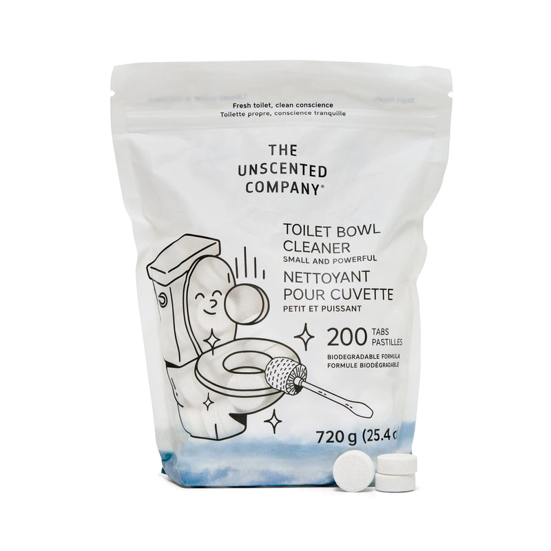 A pouch of The Unscented Company Toilet Bowl Cleaner featuring playful line art of a smiling toilet being scrubbed, labeled with product details in English and French, and showing three white cleaning tablets in front of the 720g package.