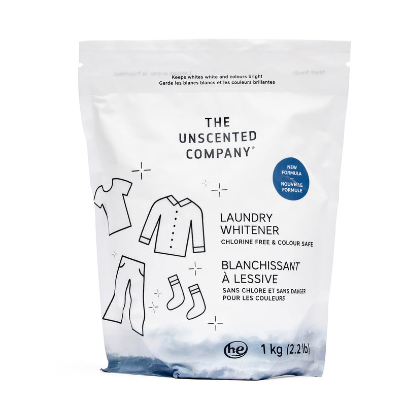 Front view of The Unscented Company Laundry Whitener pouch. The package is white with minimalist line drawings of clothing and a blue base design. Text indicates it is chlorine-free and safe for colours, with a new formula, 1 kg (2.2 lb).