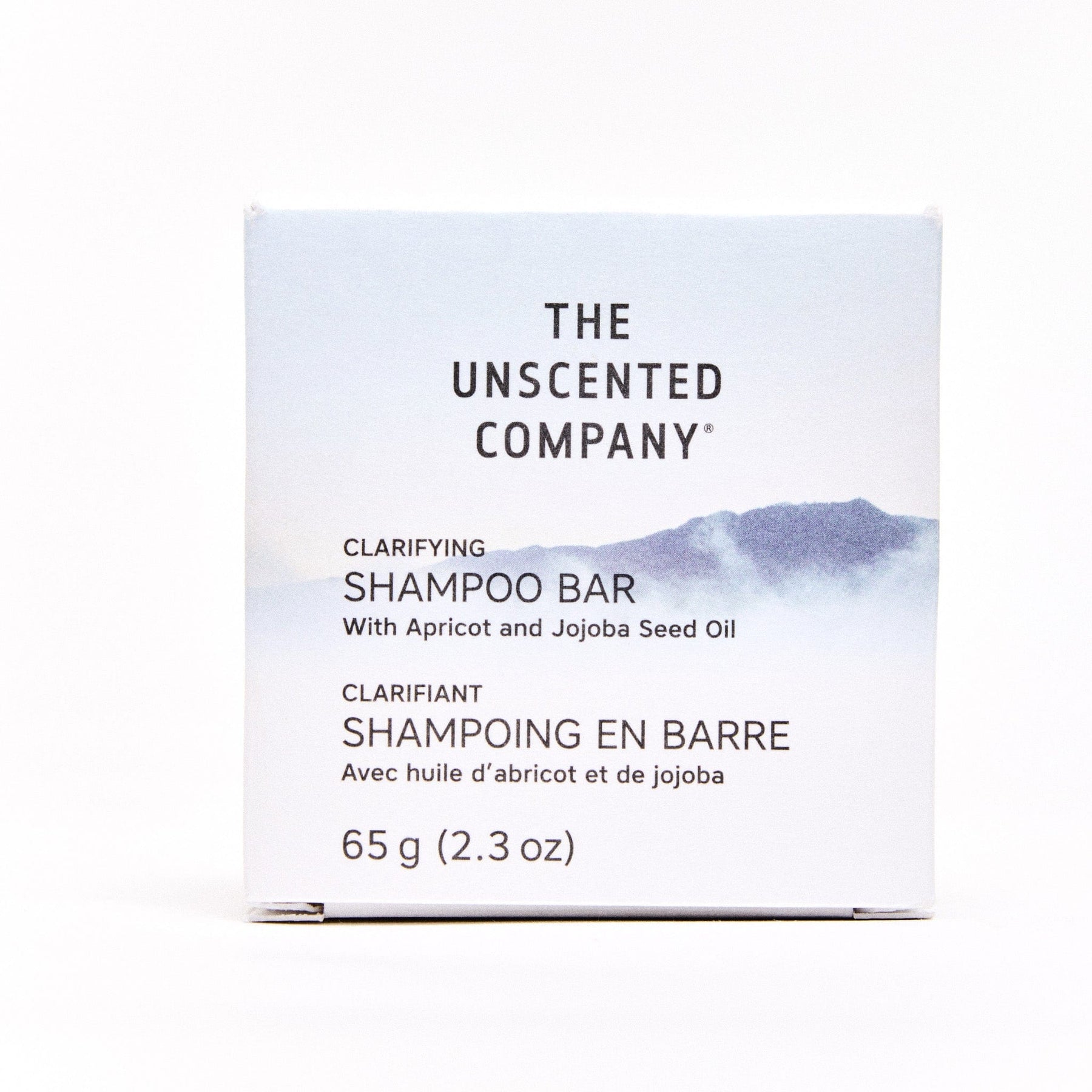 Front view of The Unscented Company Clarifying Shampoo Bar with Apricot and Jojoba Seed Oil in a minimalist box design, showing product name and weight (65g/2.3oz).