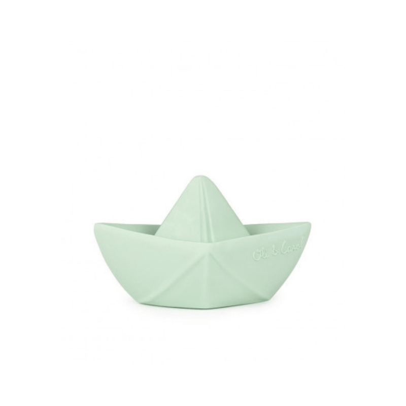 A small mint green silicone toy shaped like a paper boat.
