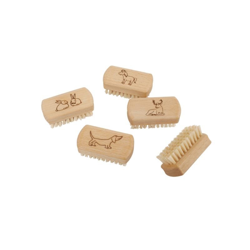Set of small wooden nail brushes with engraved animal designs on top.