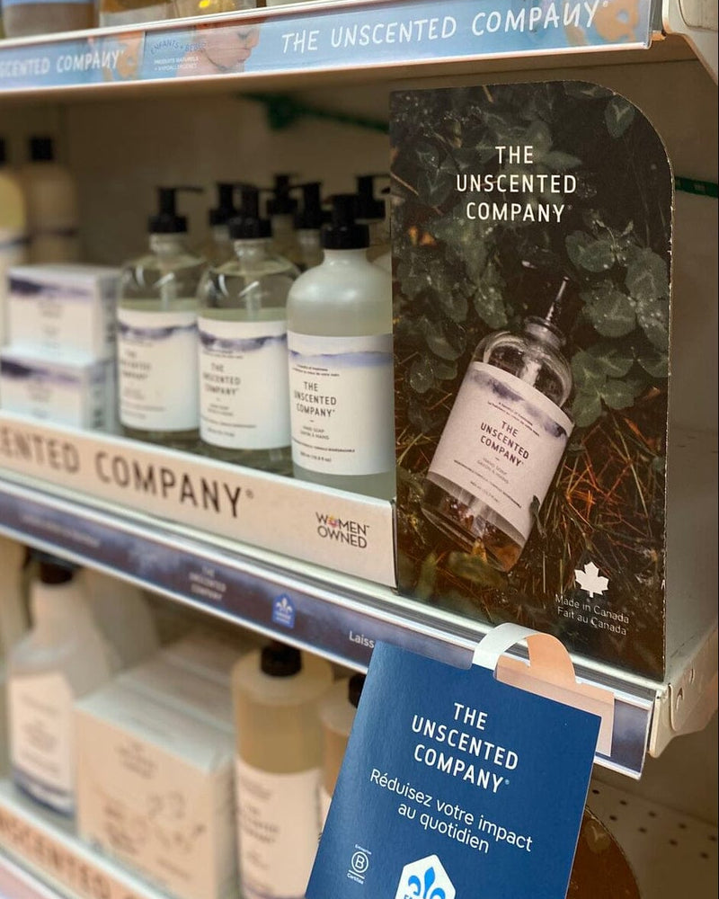 The Unscented Company eco-friendly cleaning and personal care products displayed on a retail store shelf, featuring refillable bottles, minimalist packaging, and sustainable Canadian-made goods promoting a zero-waste, low-impact lifestyle.
🇫🇷 Fra

