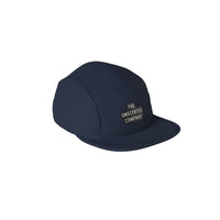 Navy blue cap with 'The Unscented Company' logo.