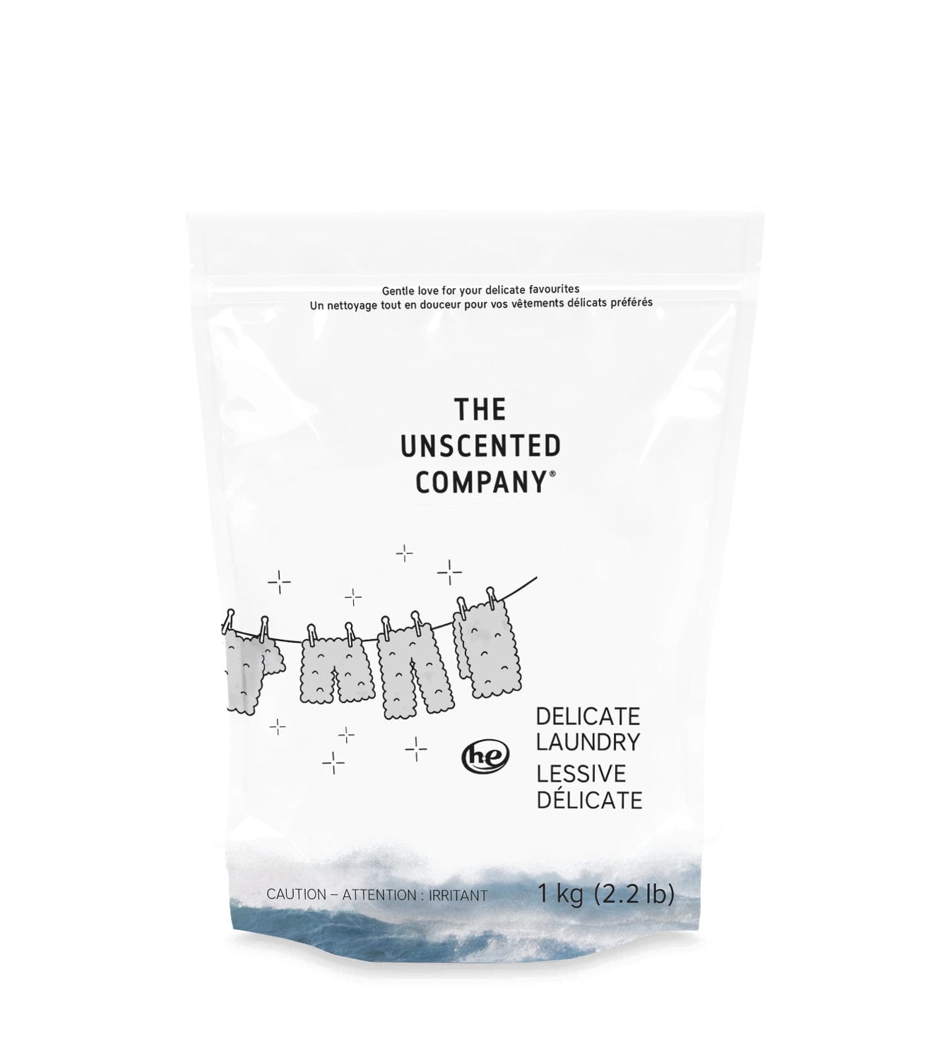 1 kg The Unscented Company delicate laundry detergent bag, featuring a clothesline illustration with garments hanging, set against a white background with a wave design at the bottom.