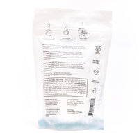 Back of The Unscented Company floor cleaner tabs pouch. Instructions illustrated across the top: “Drop in a tab,” “Let it dissolve,” and “Wash away!” Below, directions for use, ingredient list, safety warnings, and certifications are printed in English and French. The packaging mentions it's fragrance-free, dye-free, vegan, and biodegradable. Logos for B Corporation, Women Owned, and cruelty-free are also displayed.