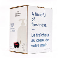 Side view of The Unscented Company 10 L hand soap box with dispenser tap, featuring the text “A handful of freshness,” on minimalist white eco-friendly packaging.