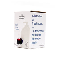 Side view of The Unscented Company 4 L hand soap box with dispenser tap, featuring the text “A handful of freshness,” on minimalist white eco-friendly packaging.