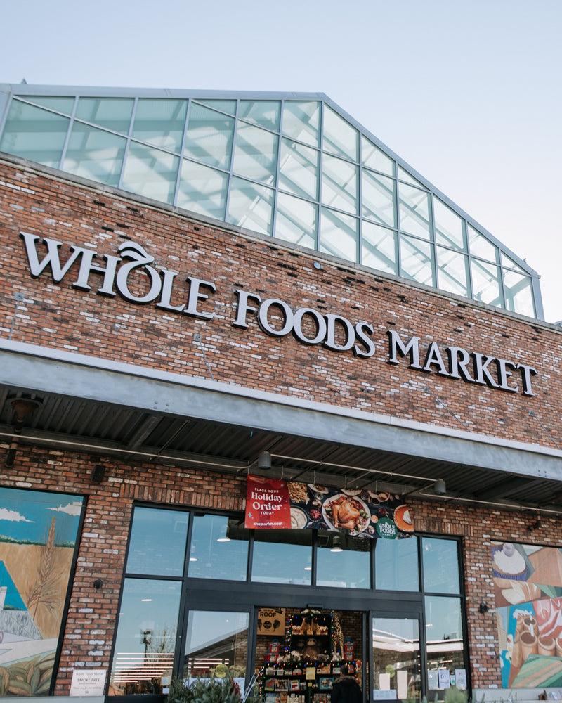 Exterior of a Whole Foods Market store where The Unscented Company products are available, highlighting the brand’s expansion into major natural and organic retail partners.
