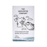 Front of The Unscented Company stain remover bar packaging, illustrated with a sparkling clean t-shirt and a soap bar character, with “Fragrance-free”, “Never tested on animals”, and “Vegan” labels on the side.