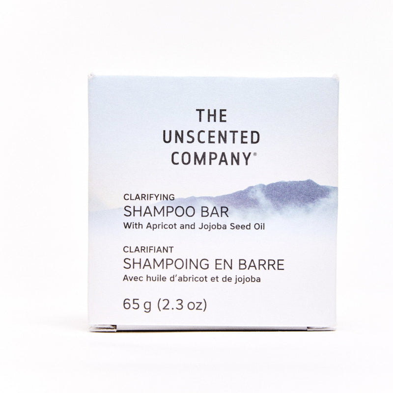 Front view of The Unscented Company Clarifying Shampoo Bar with Apricot and Jojoba Seed Oil in a minimalist box design, showing product name and weight (65g/2.3oz).